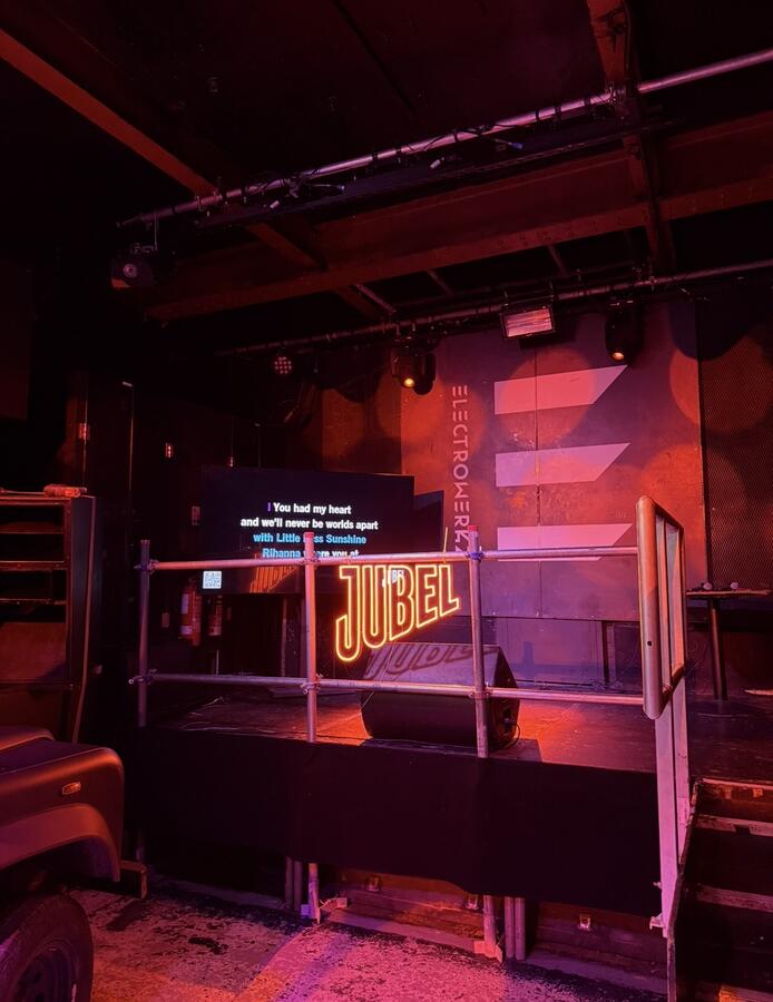 Jubel neon sign on stage at Electrowerkz
