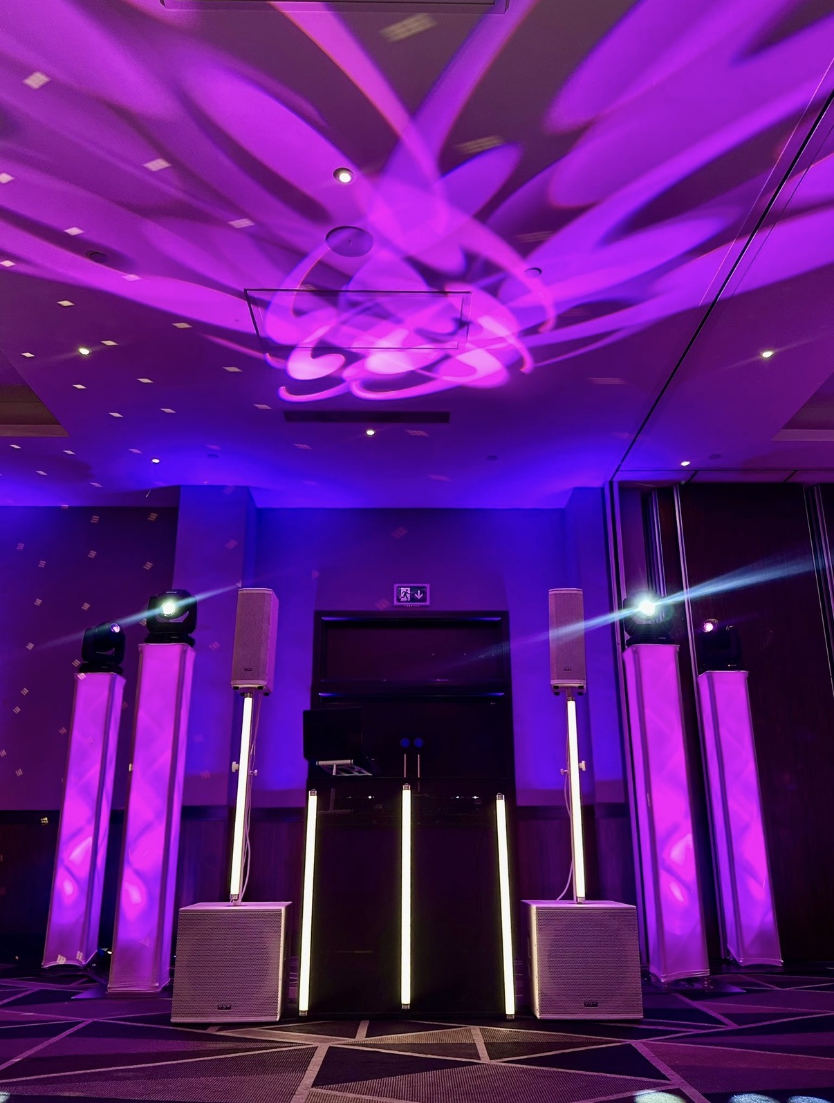 Corporate awards night ballroom with purple lighting, LED tubes and moving heads