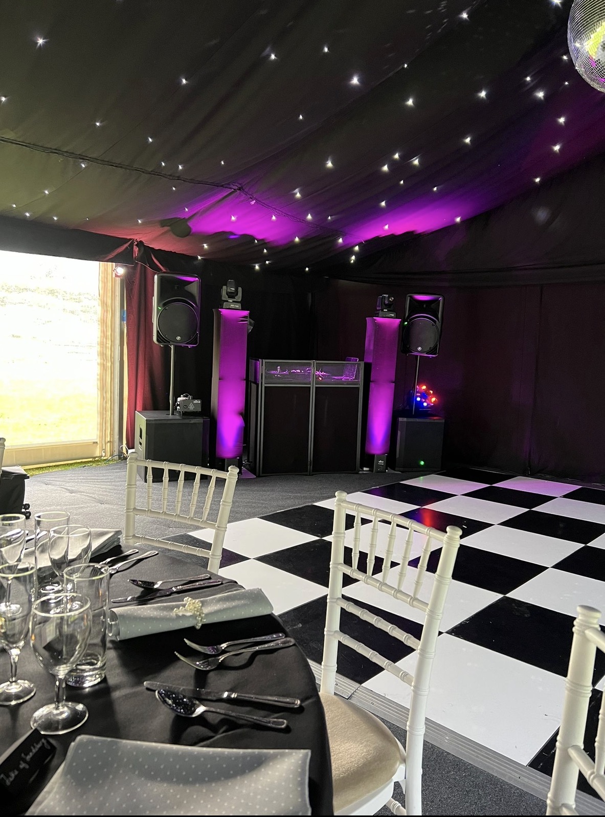 Marquee party in Essex with starcloth ceiling, mirror ball and chequered dance floor