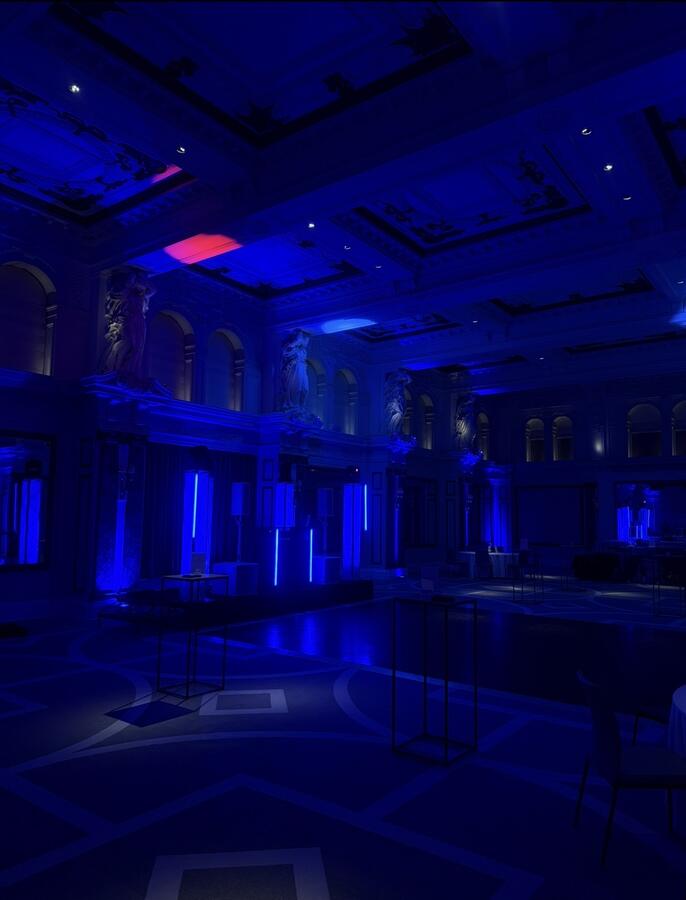 Blue atmospheric lighting in grand ballroom