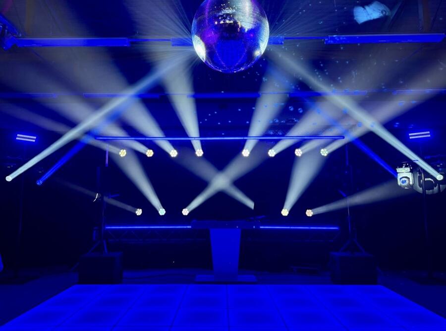 Mirror ball with beam lighting rig at village hall summer party in Essex